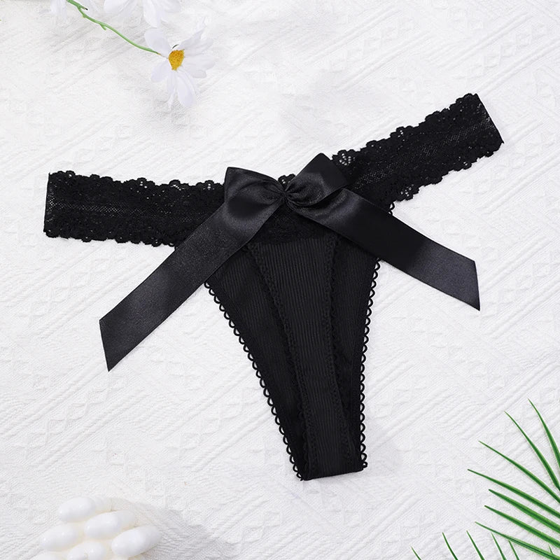 Black lace thong with satin bow at waist and scalloped edges