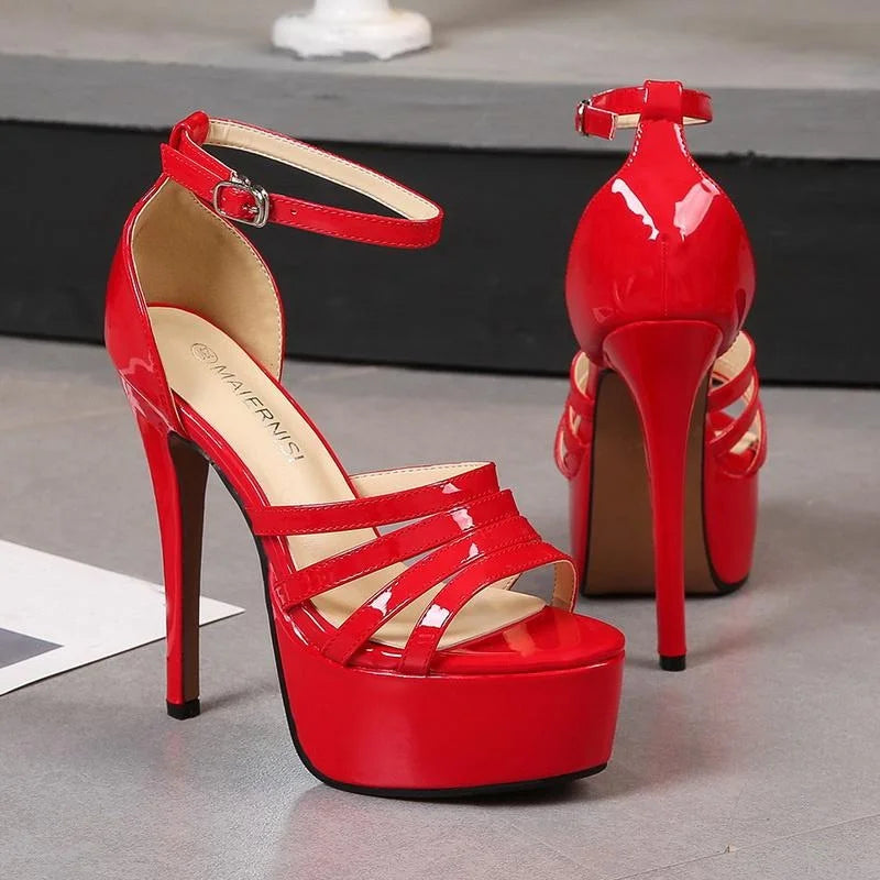 Red platform crown heels pair with ankle strap and open toe cutout straps