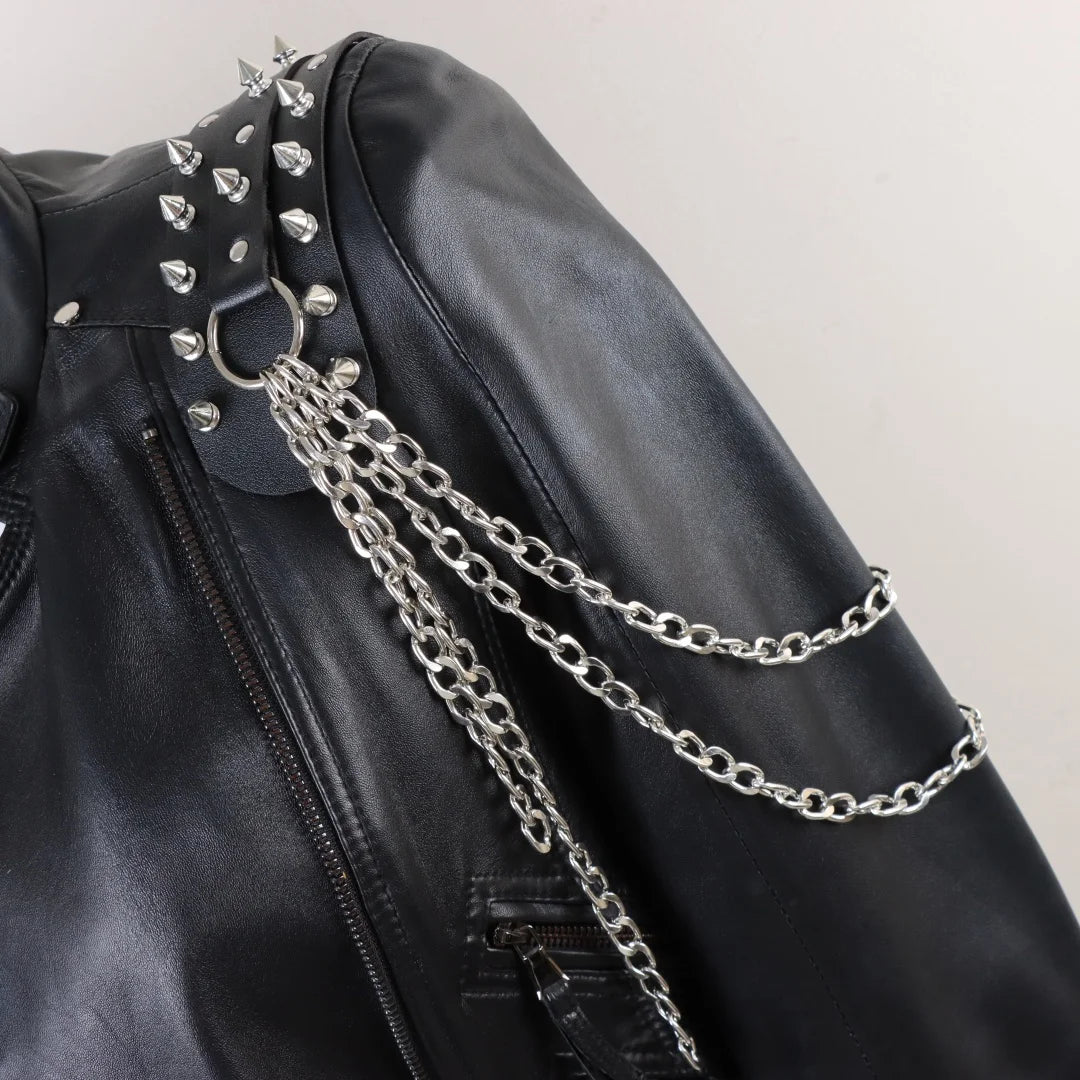 Darkvolt leather harness with studded collar panel and layered silver chain drape