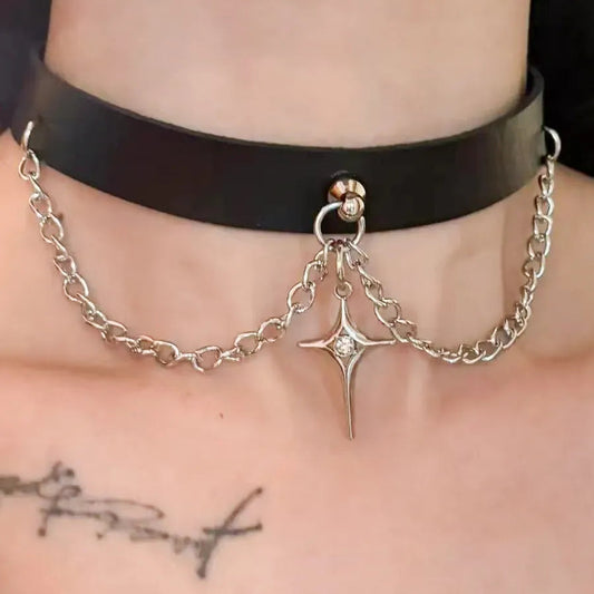 Black leather choker with hanging star pendant on silver curb chain