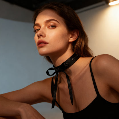 Black choker with ribbon ties and grommet eyelets with open-back dress straps