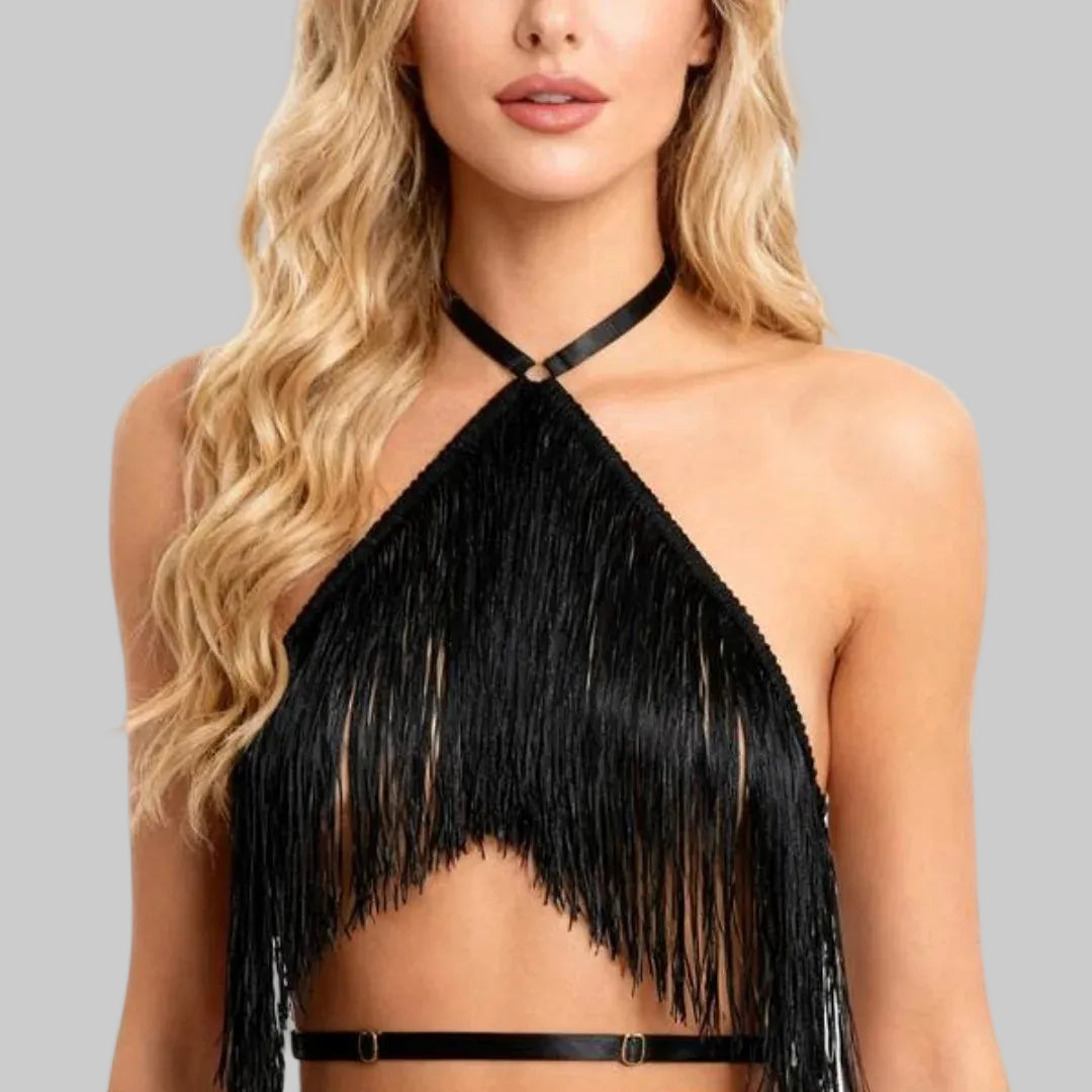 Black fringe halter top worn by a model on a white background