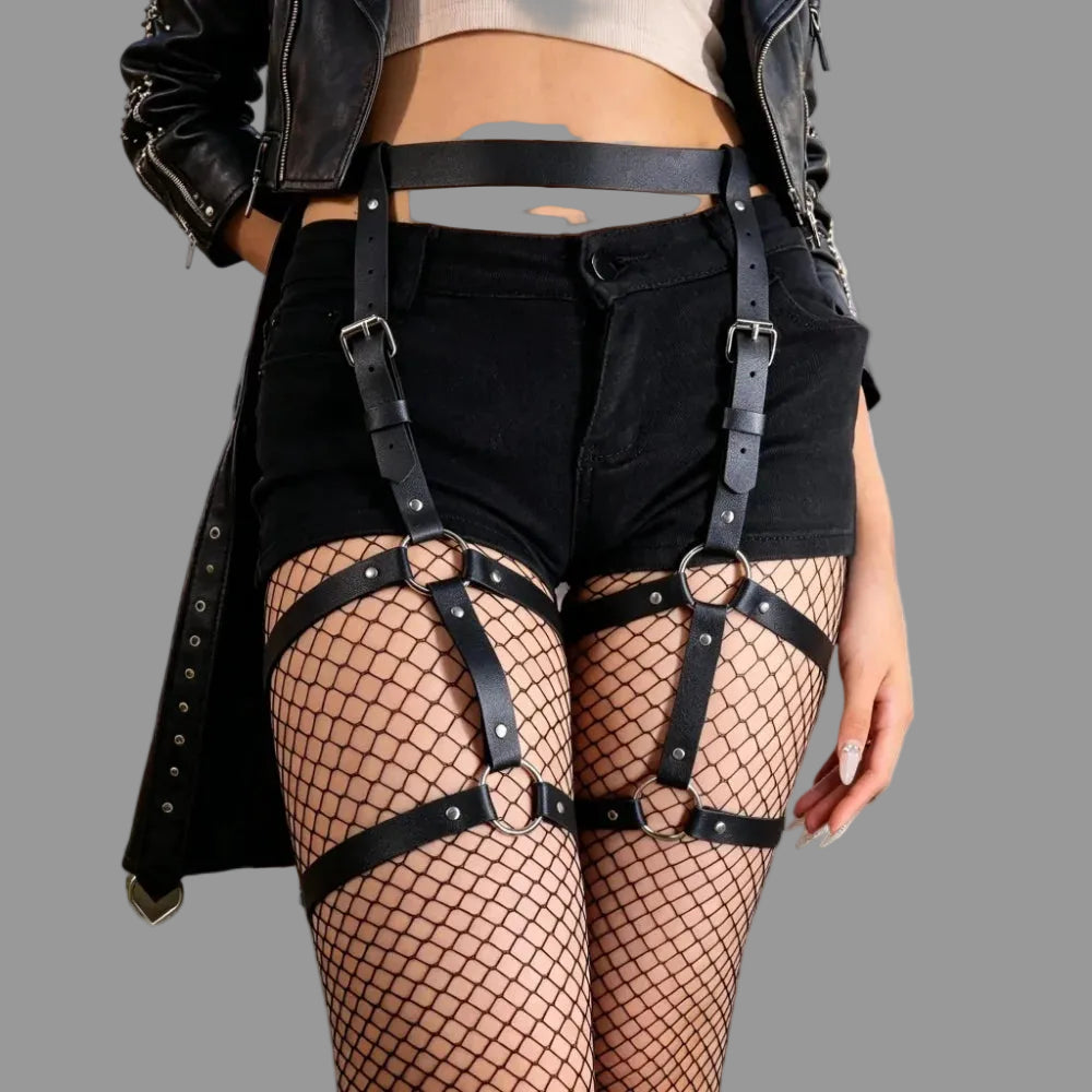 Black leg harness with fishnet thigh panels, black straps, and metal ring buckles