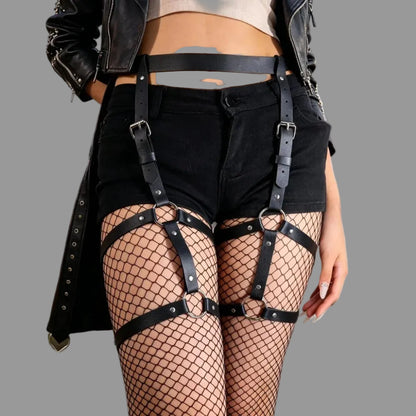 Black leg harness with fishnet thigh panels, black straps, and metal ring buckles