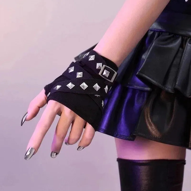 Black studded fingerless wrist warmers with silver pyramid accents and side ties