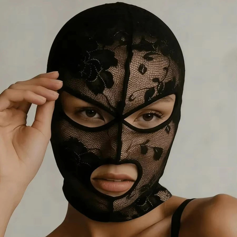 Black mesh face veil mask with floral lace pattern and cutouts around eyes and mouth