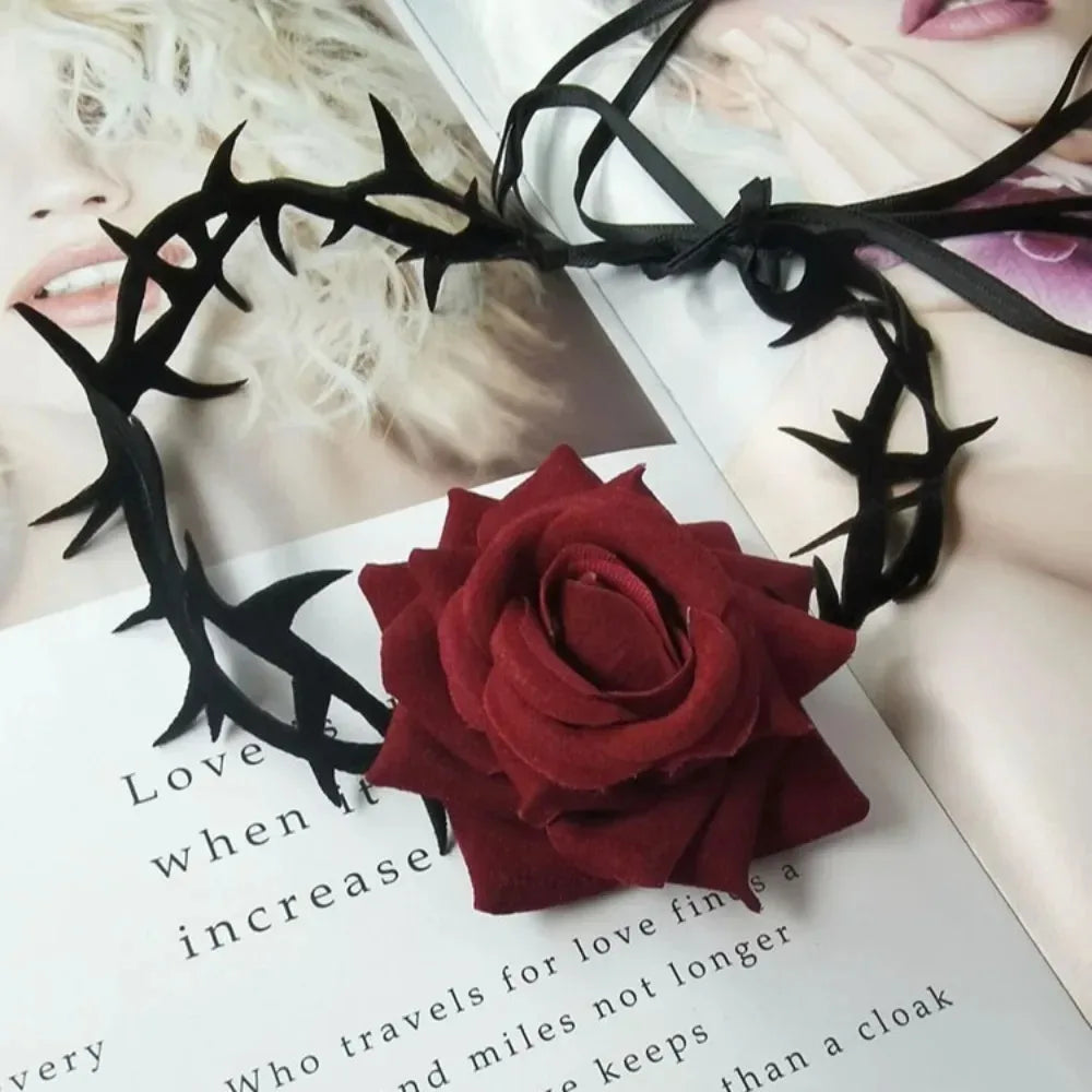 Red rose charm necklace with black gothic metal motifs and ribbon-like ties