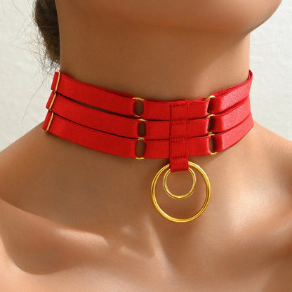 Red triple-ring choker with three strap rows and gold circular ring pendant