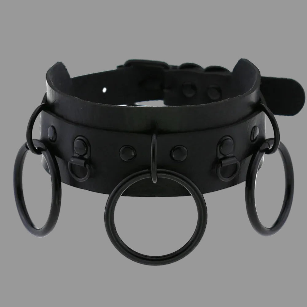 Black gothic choker with studded strap and three O-ring accents, front circular ring