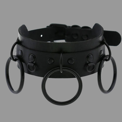 Black gothic choker with studded strap and three O-ring accents, front circular ring