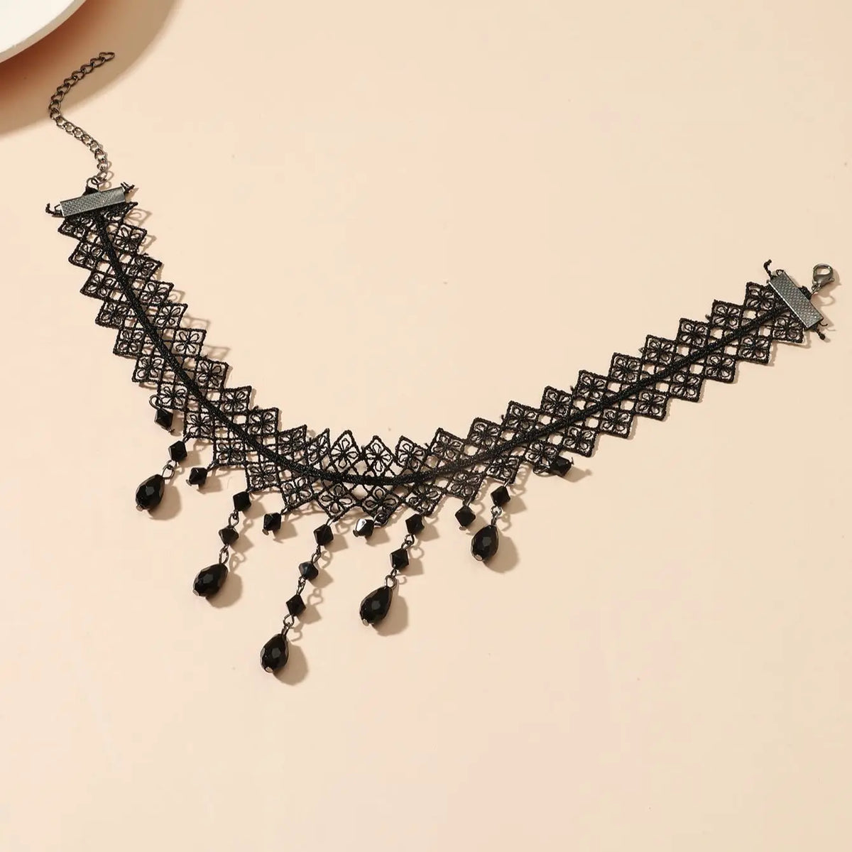 Black openwork lace choker with long teardrop crystal fringe