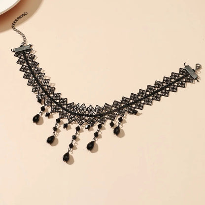 Black openwork lace choker with long teardrop crystal fringe