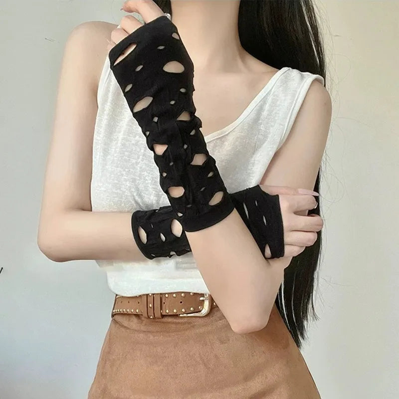 Black long arm warmers with oval cutout pattern, fingerless design