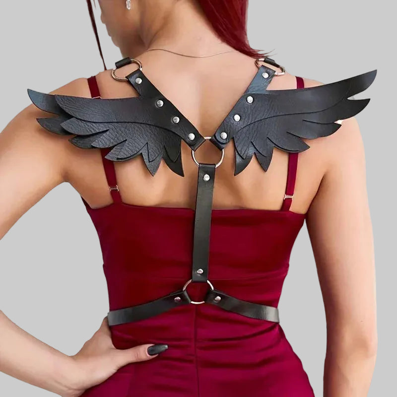 Zelvique Darkflight harness with black winged shoulder plates and straps over burgundy dress