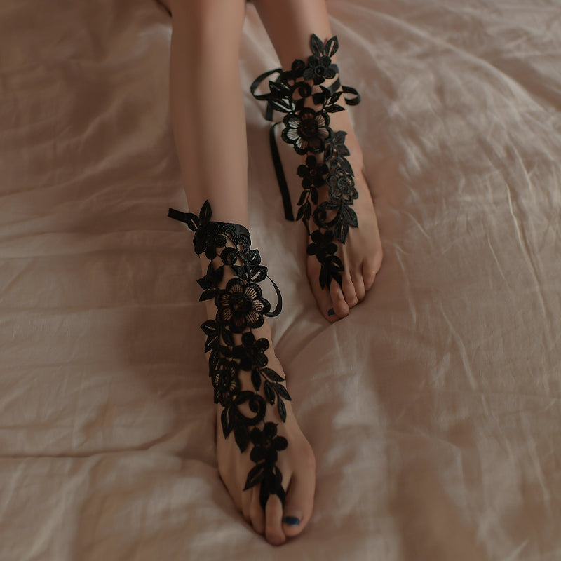 Black lace ankle garters with floral applique and ribbon bows