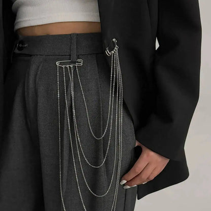 Layered silver chain drape belt with multiple hanging loops and clasp at waistband
