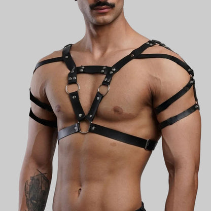 Black leather chest harness with crisscross design, metal rings, and wide shoulder straps
