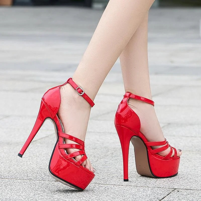 Red patent platform crown heels with ankle strap and crisscross cutout straps