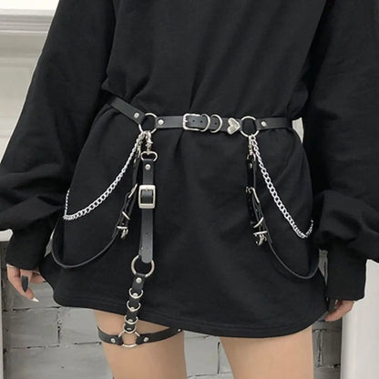 Black mini dress with wide belt, two chain drops, and metal clip details