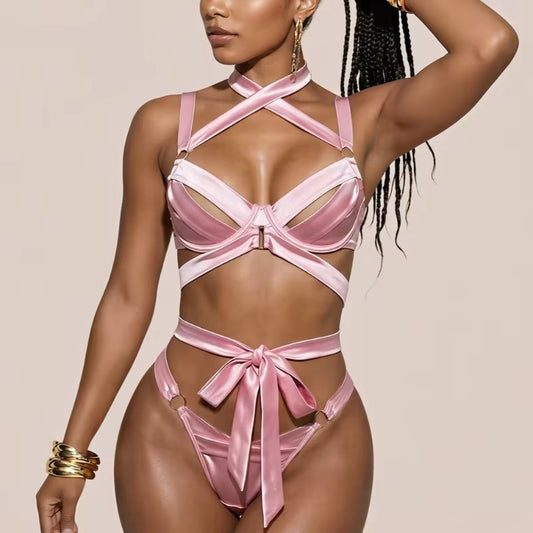 Pink satin lingerie with underwire bra and bow-trim thong-style bottoms