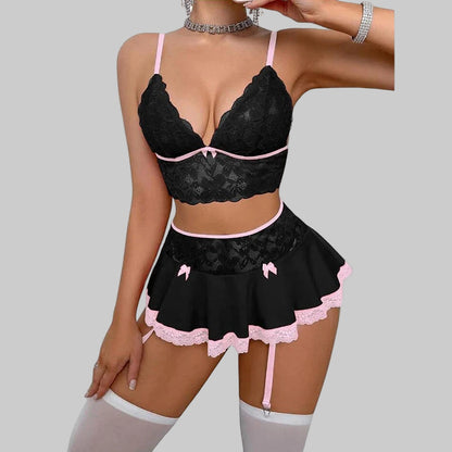 Black lace lingerie set with pink accents on a white background