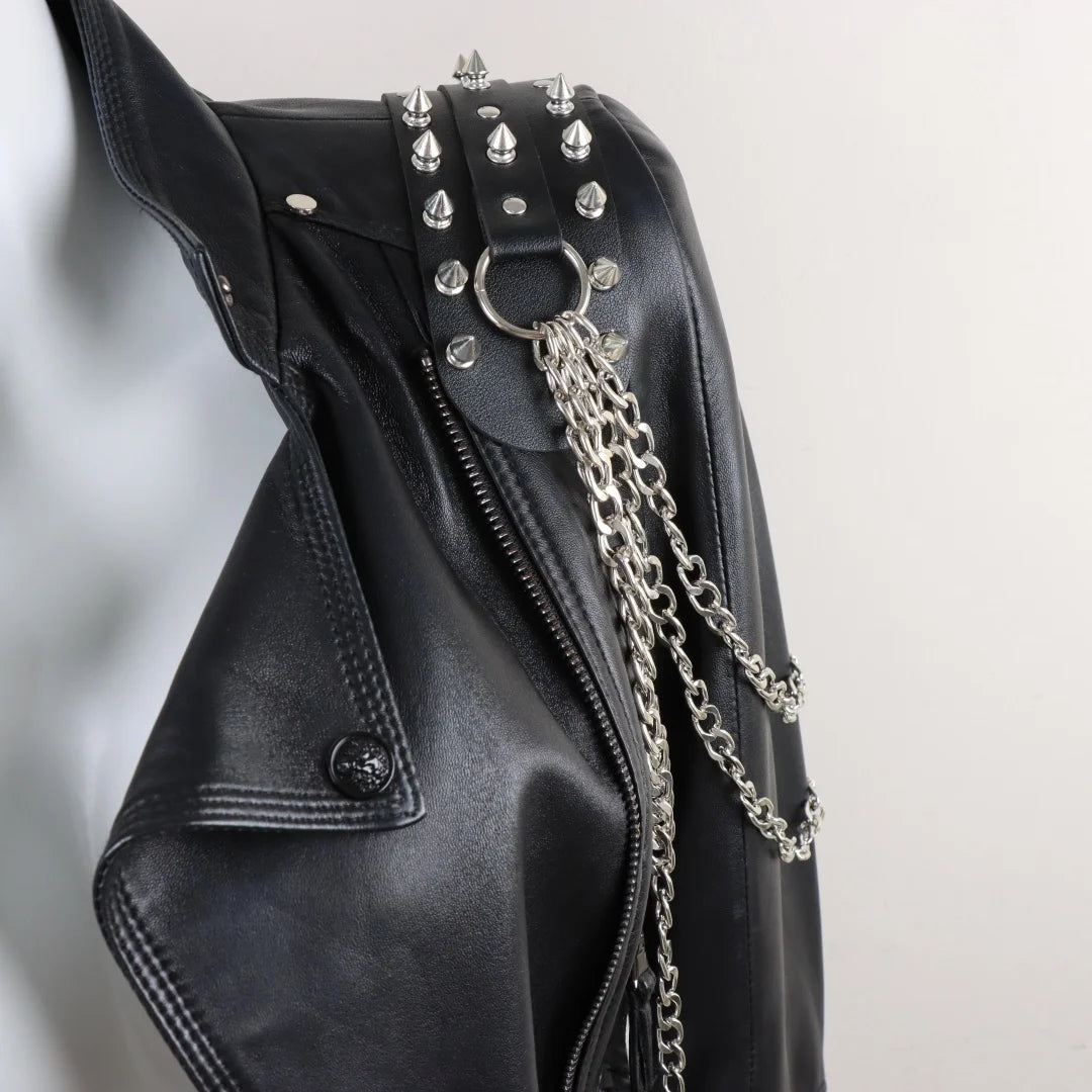 Darkvolt leather harness with spiked studs, O-ring hardware, and long layered chain straps