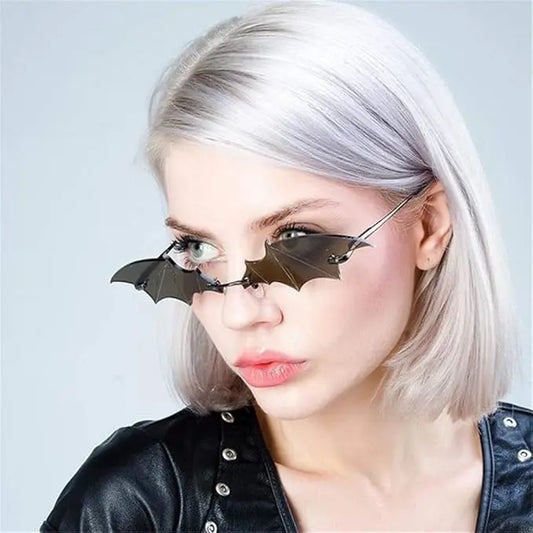 Bat-wing style sunglasses with black metal frame and dark tinted lenses
