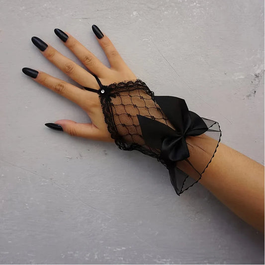 Black lace mesh fingerless gloves with pearl button and tied satin bow
