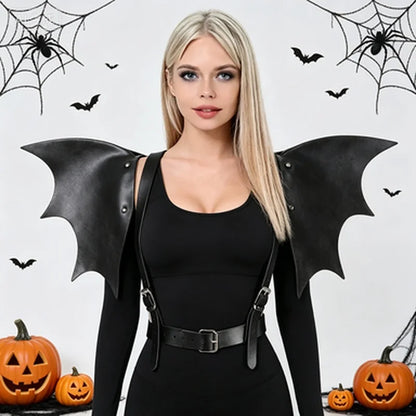Black batwing harness cinch dress with studded wing sleeves and front belt straps