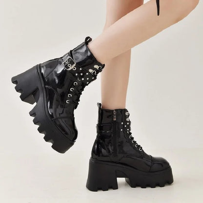 Black patent lace-up boots with metal buckle straps and high block heel