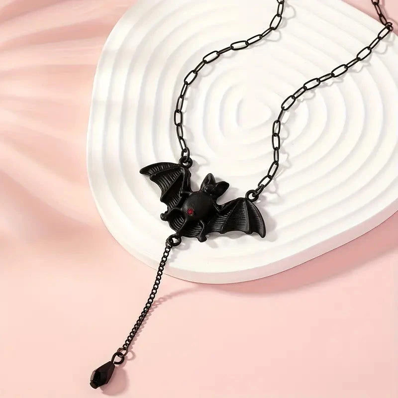 Black bat pendant necklace with Y-shaped chain and dangling teardrop charm