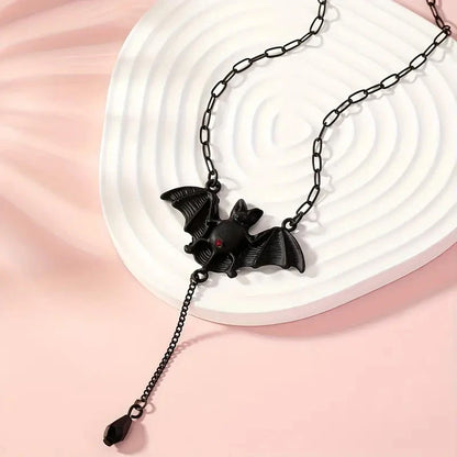 Black bat pendant necklace with Y-shaped chain and dangling teardrop charm