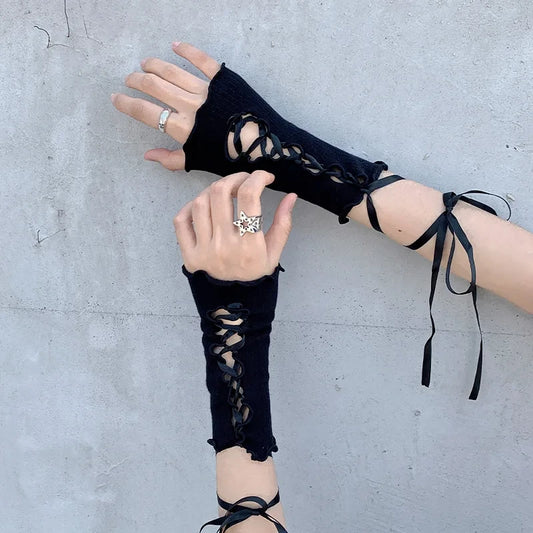 Black ribbed fingerless gloves with lace-up cuffs and long ribbon ties