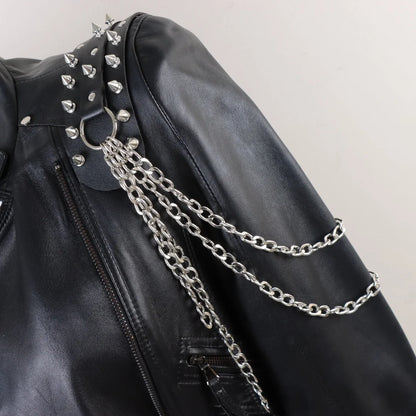 Darkvolt leather harness with studded collar panel and layered silver chain drape