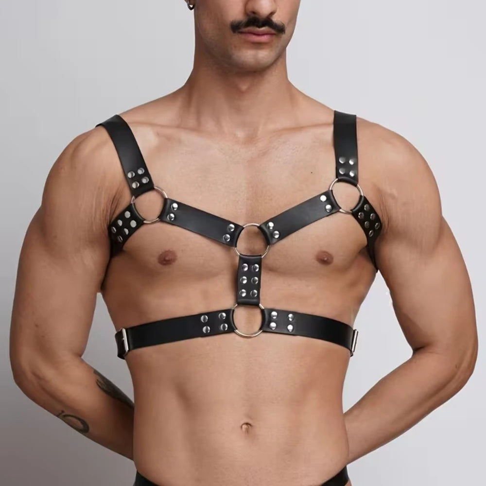 Black chest harness belt with studbed straps, metal rings, and horizontal waist band