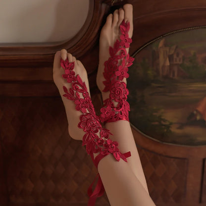 Red lace ankle garters with floral applique and ribbon ties