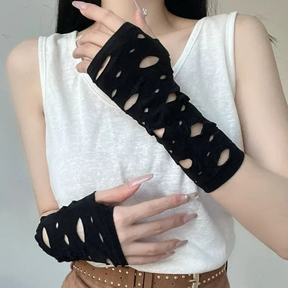 Black fingerless arm warmers with oval cutouts, worn on forearms