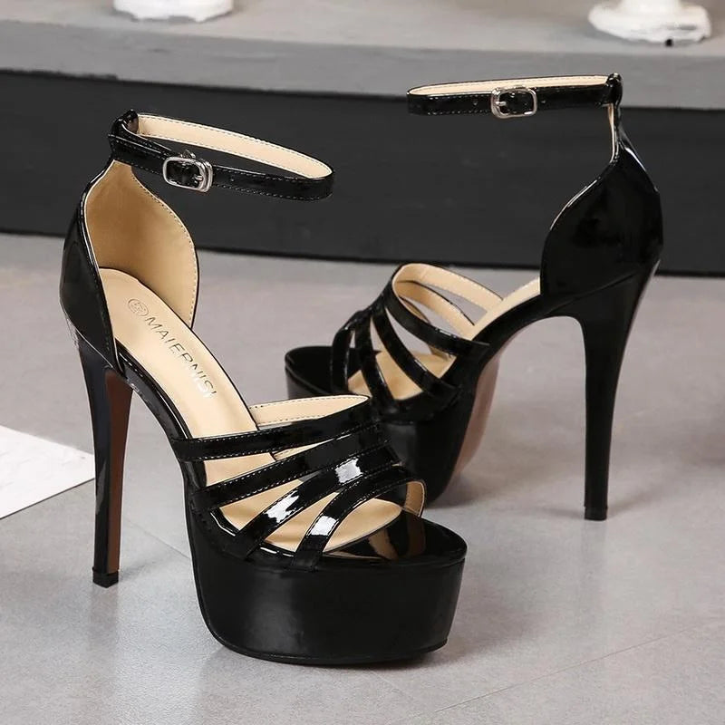 Black platform crown heels pair with ankle strap and open toe cutout straps