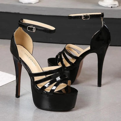 Black platform crown heels pair with ankle strap and open toe cutout straps