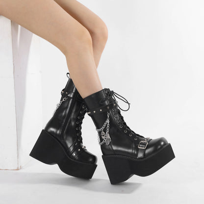 Black chunky-heel lace-up boots with buckle strap and silver chain tassel detail
