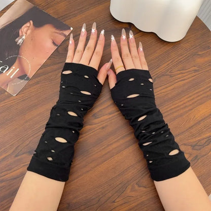Pair of black cutout fingerless arm warmers with oval openings