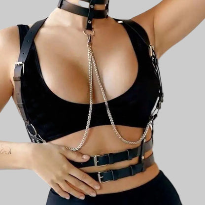 Black leather harness with chains on a plain background