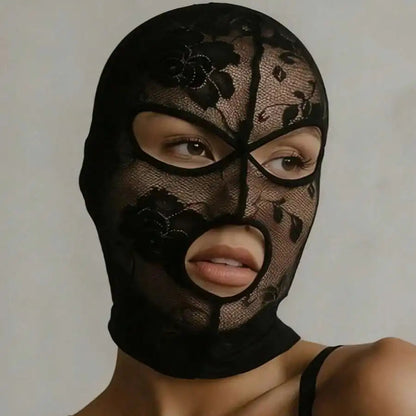 Black lace face veil mask with pointed hood shape and central seam down the face