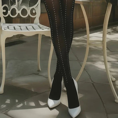 Full-length black velvet tights with dotted vertical rhinestone pattern