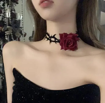 Black thorn choker necklace with small red rose centerpiece and hook clasp