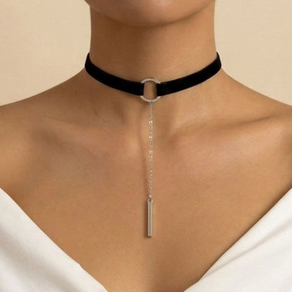 Black velvet choker necklace with silver-tone ring and long vertical bar pendant