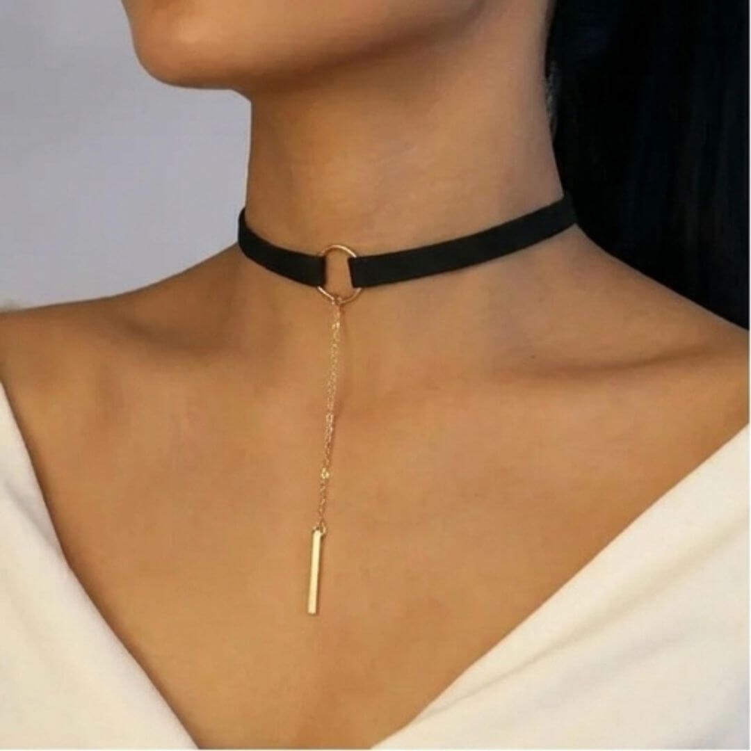 Black velvet choker with gold-tone ring and long chain vertical bar pendant
