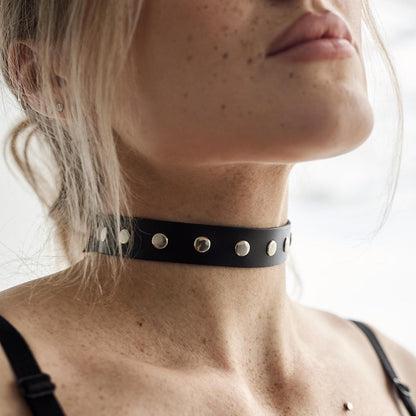 Black choker with metal grommets and eyelets, adjustable fit