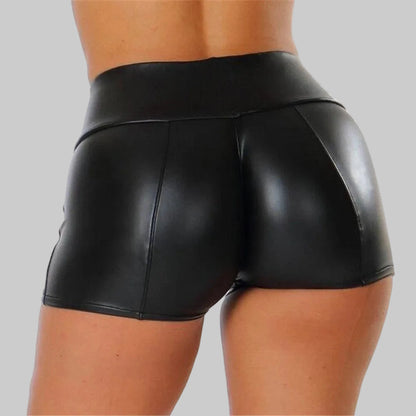Black leather shorts worn by a person on a white background