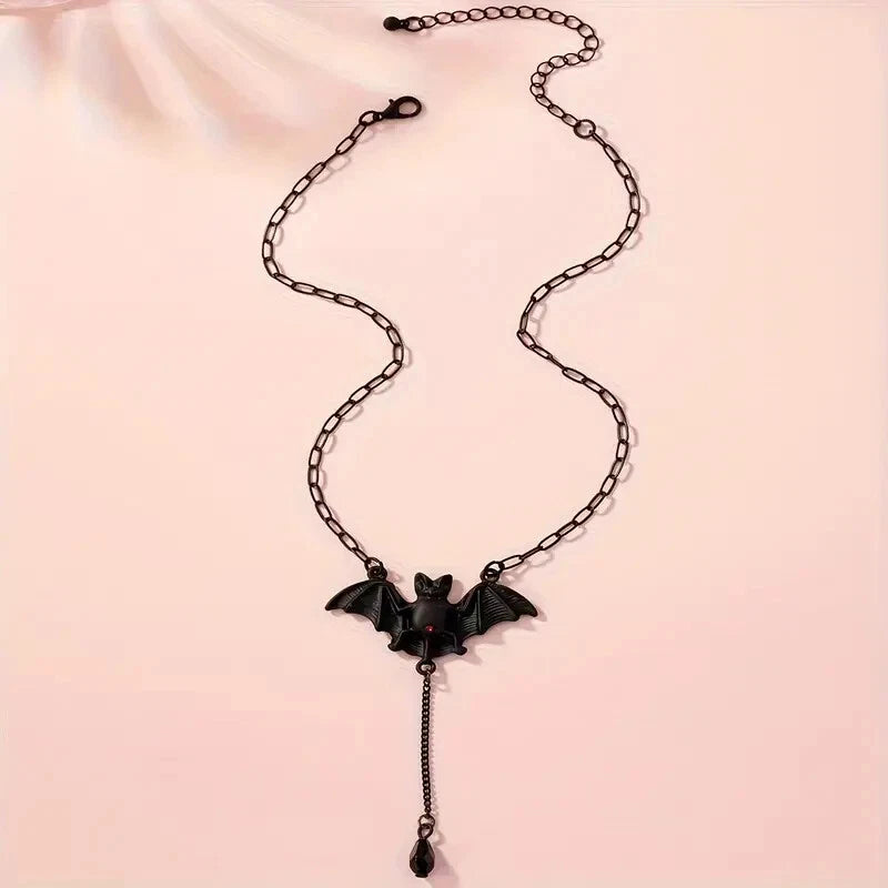 Long black chain necklace with bat pendant and teardrop dangle